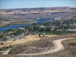 Birds-eye view of Bridgeport with Columbia River Bridge and Chief Joseph Dam in background, 2007. The nearest shore of the river is largely residential and the far shore primarily agriculture. 
