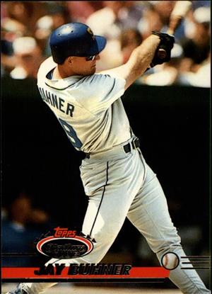  Topps baseball card photograph of Jay Buhner, Seattle Mariner right fielder, jersey number 8, shown taking a mighty swing while at bat during Mariners game circa 1994