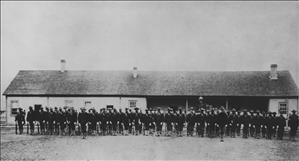 Long row of men in military uniform facing camera
