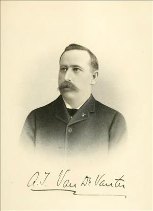 Sepia photo of essay subject with a handlebar mustache and his signature below