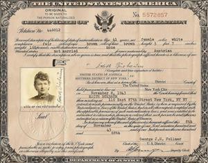 Sepia tone government issued document with decorated borders and photo of Buxbaum on the left hand side