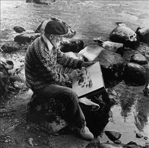 An older Meitzler in a flat brimmed cap and sweater drawing plein air with charcoal  at the bank of a river