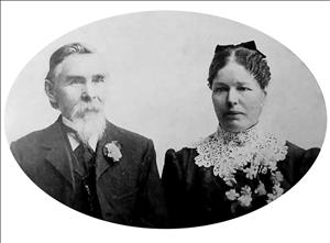 Stevenson and Fell posing seated in formal attire